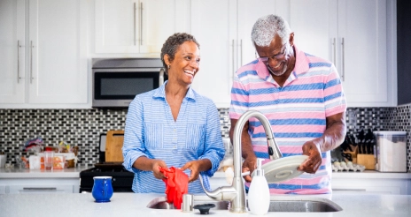 Man and woman cleaning dishes